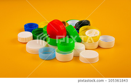 Plastic Bottle Caps Pile. Recycling HDPE Material Group, Circle Polyethylene Lid Set, Colorful Caps Group Plastic Bottle Caps Pile. Recycling HDPE Material Group, Circle Polyethylene Lid Set, Colorful Caps Group 105361843