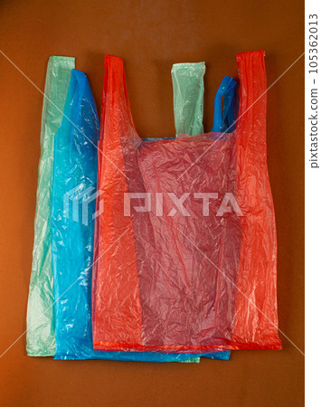 Many Plastic Bags on Brown Background. Crumpled Plastic Bag after Shopping, Cellophane Packaging Waste 105362013