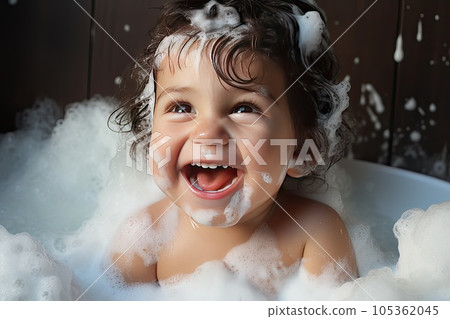 Close-up photo of a happy little boy in bath. 105362045
