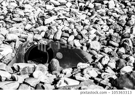 underground drainage storm drain with winged walls surrounded by rock for erosion control underground drainage storm drain with winged walls surrounded by rock for erosion control 105363313