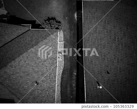 Area in-between two residential houses with property line between  105363329