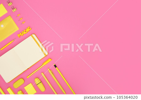 Card with yellow school and office stationery set on pink background. 105364020