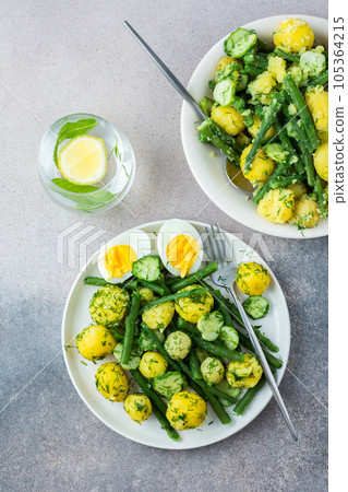 Boiled potatoes with asparagus beans and cucumbers 105364215