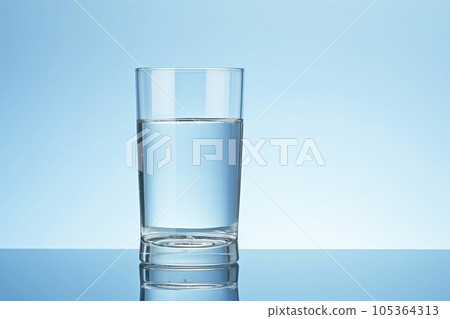 A clear glass glass is on the table 105364313