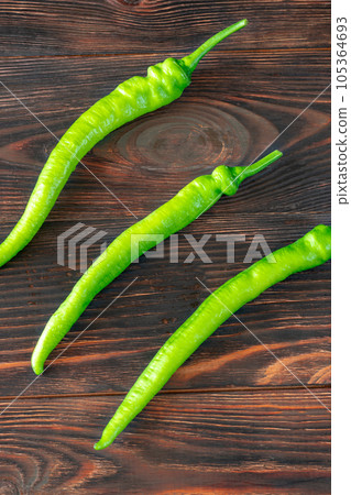 Green chili peppers 105364693