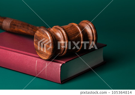 Judge gavel and legal book close up on table Judge gavel and legal book close up on table 105364814