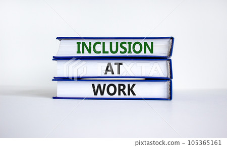 Inclusion at work symbol. Books with words 'Inclusion at work' on beautiful white background. Business, inclusion at work concept. Copy space. 105365161