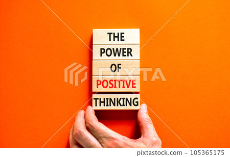 Positive thinking symbol. Concept words The power of positive thinking on wooden block. Beautiful orange background. Businessman hand. Business, motivational positive thinking concept. Copy space. Positive thinking symbol. Concept words The power of positive thinking on wooden block. Beautiful orange background. Businessman hand. Business, motivational positive thinking concept. Copy space. 105365175