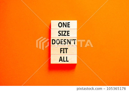 One size does not fit all symbol. Concept words One size does not fit all on wooden blocks. Beautiful orange table orange background. One size does not fit all business concept. Copy space. 105365176
