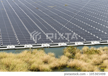View of the floating Solar power system on the flood detention basin in Kaohsiung, Taiwan. View of the floating Solar power system on the flood detention basin in Kaohsiung, Taiwan. 105365499