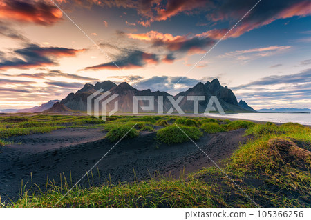 Sunrise dramatic sky over Vestrahorn mountain on black sand beach in Stokksnes peninsula at Iceland Sunrise dramatic sky over Vestrahorn mountain on black sand beach in Stokksnes peninsula at Iceland 105366256