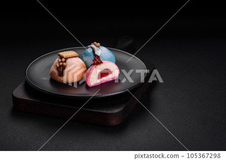 Delicious sweet colorful mochi desserts or ice cream with rice dough and toppings 105367298