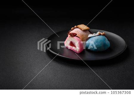 Delicious sweet colorful mochi desserts or ice cream with rice dough and toppings 105367308