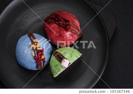 Delicious sweet colorful mochi desserts or ice cream with rice dough and toppings 105367346