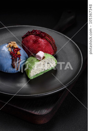Delicious sweet colorful mochi desserts or ice cream with rice dough and toppings 105367348