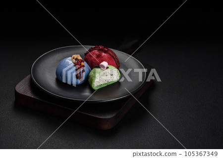 Delicious sweet colorful mochi desserts or ice cream with rice dough and toppings 105367349