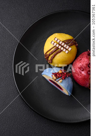 Delicious sweet colorful mochi desserts or ice cream with rice dough and toppings 105367361