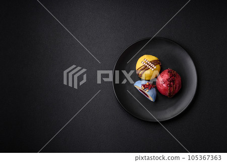 Delicious sweet colorful mochi desserts or ice cream with rice dough and toppings Delicious sweet colorful mochi desserts or ice cream with rice dough and toppings 105367363