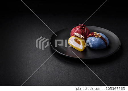 Delicious sweet colorful mochi desserts or ice cream with rice dough and toppings 105367365