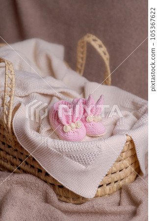 Cute wooden and knitted baby toys on light background. Eco accessories and teethers for newborns. . High quality photo 105367622