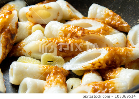 A cooking scene where chikuwa and garlic are fried in a frying pan. A cooking scene where chikuwa and garlic are fried in a frying pan. 105369534
