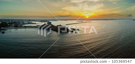 Aerial view "Aomori Prefecture" Black-tailed gull breeding area Kabushima Hachinohe City dyed in the sunset 105369547