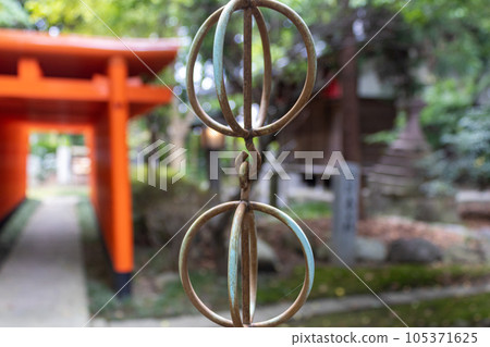 Rings on traditional rain chain, kusaridoi at shrine. Kanazawa, Japan. Rings on traditional rain chain, kusaridoi at shrine. Kanazawa, Japan. 105371625