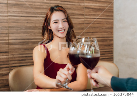 Young couple celebrating toasting  restaurant. 105373044