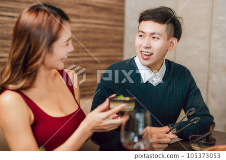 Happy couple dining in hotpots restaurant Happy couple dining in hotpots restaurant 105373053