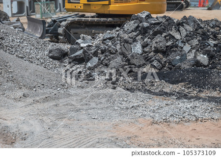 Heavy machinery processing asgard at a civil engineering site 105373109