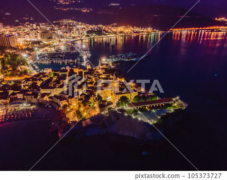 Budva city lights from Montenegro seen from above. Night view. Drone old town Budva at night 105373727