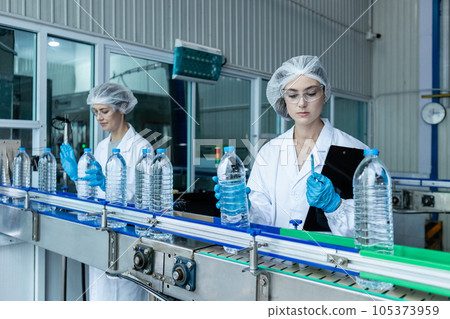Team factory worker sterile uniform manufacture drink water. Female specialist factory line 105373959