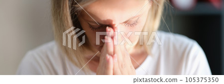 Tired woman in depression hopes for changes in life for the better. 105375350