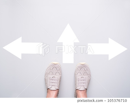 Foot Standing on White Wall with Sign Arrow Change Way,Alone Young Girl Go Walk Journey Step,Start Choice New Life,Strong woman,Business Finance Trade Stock Market Profit or Loss ,Broken Heart Concept 105376710