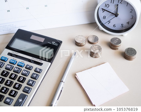 Calculator with Stack Coin,Pen,Clock,Paper Note on Table Background,Cash Money in Ofice,for Business Investment Income Finance Insurance Rate Number Bank,Accounting Currency Loan Credit Tax Concept. Calculator with Stack Coin,Pen,Clock,Paper Note on Table Background,Cash Money in Ofice,for Business Investment Income Finance Insurance Rate Number Bank,Accounting Currency Loan Credit Tax Concept. 105376819