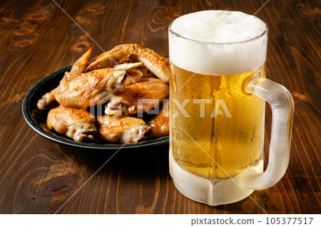 Beer and chicken wings Beer and chicken wings 105377517