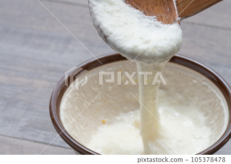Japanese yam ladle scooped with a spoon 105378478