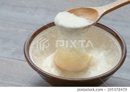 Japanese yam ladle scooped with a spoon 105378479