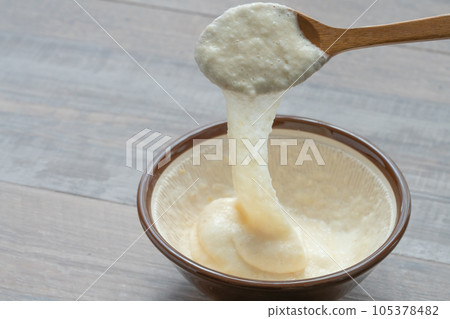 Japanese yam ladle scooped with a spoon 105378482