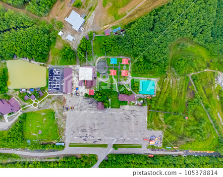 The ski base is in autumn. 105378814