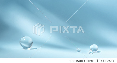 Blue background with transparent glass balls. Minimal concept and hard sunlight. 105379684