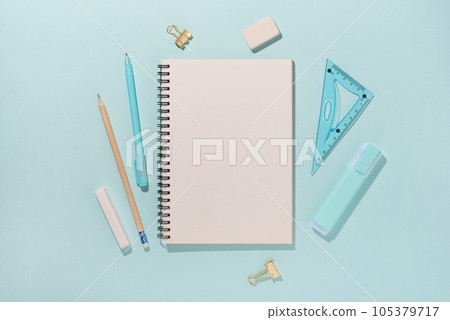 School supplies on blue background. Back to school concept. Top view. Copy space. School supplies on blue background. Back to school concept. Top view. Copy space. 105379717