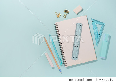 School supplies on blue background. Back to school concept. Top view. Copy space. School supplies on blue background. Back to school concept. Top view. Copy space. 105379719