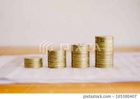 Stack of golden money coin on accounting sheet. Business and Financial concept.  105380407