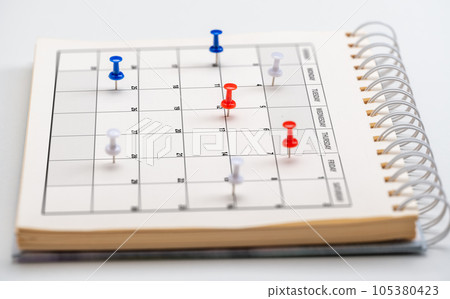 Scheduling and planning concept, calendar with colorful pin on white table. Embroidered pins on calendar event. Planner calendar,clock to set timetable organize schedule Scheduling and planning concept, calendar with colorful pin on white table. Embroidered pins on calendar event. Planner calendar,clock to set timetable organize schedule 105380423