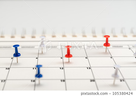 Business management event, business plan targeted marketing activities. Embroidered pins on calendar event. Planner calendar, planning for business meeting or travel planning 105380424