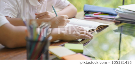 Asian father helps son to do her homework for the school..child study together homeschooling concept getting homework help from father Asian father helps son to do her homework for the school..child study together homeschooling concept getting homework help from father 105381455
