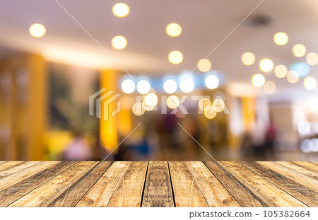 Old wooden table with blurred hotel lobby background Old wooden table with blurred hotel lobby background 105382664