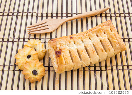 Pineapple pie and cookies on wooden table 105382955