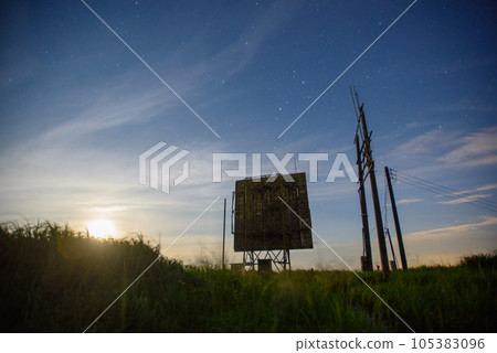Abandoned antenna equipment at a radar station. Long exposure shot at night. 105383096